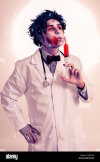 a-scary-zombie-doctor-with-a-syringe-with-blood-with-a-filter-effect-E8R1HP.jpg