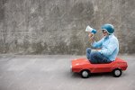 portrait-funny-businessman-outdoor-senior-man-driving-retro-pedal-car-back-work.jpg