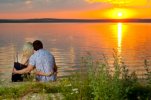 15199828-romantic-evening-date-on-nature-couple-on-beautiful-sunset-on-lake.jpg