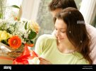 young-couple-with-flowers-A3AGD4.jpg