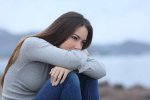 115370527-sad-girl-looking-away-sitting-alone-on-the-beach.jpg