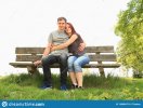 couple-lovers-bench-young-women-girl-black-t-shirt-blue-jeans-hugging-men-grey-pants-wooden-13...jpg