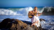 desktop-wallpaper-girl-with-guitar-in-the-ocean-guitar-oceans-girl-singer.jpg